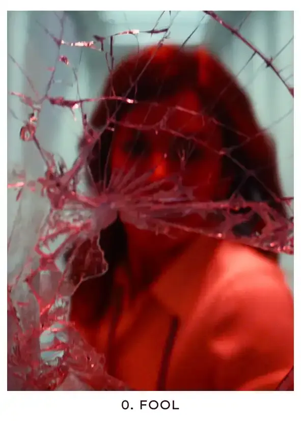 Fool: A picture of Helly trying to break out of the Severed floor before she's sent to the break room, lit red by alarm lights as she smashes the door with a fire extinguisher. She doesn't yet know what torture awaits her, and her recklessness is a reminder to Mark of what innocence they beat out of him.