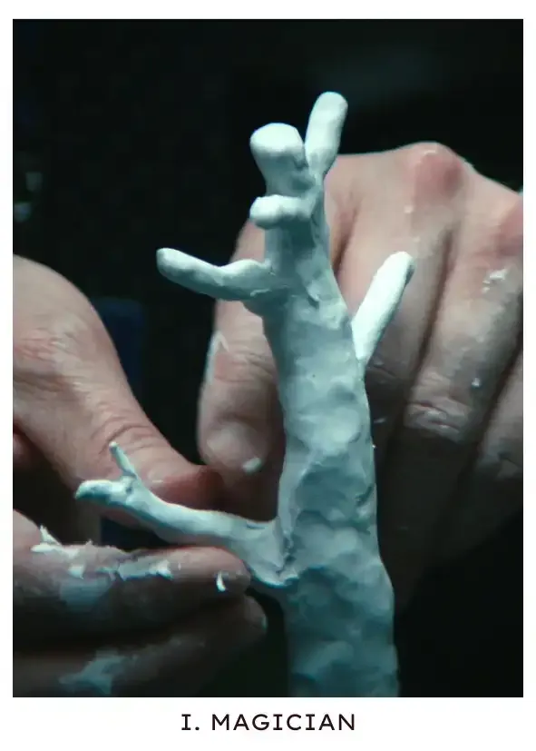 Magician: A close-up of Mark's hands sculpting the tree where his outie's wife, Gemma, died, encouraged by the smell of a contraband candle and the subconscious memory of a visit the night before.