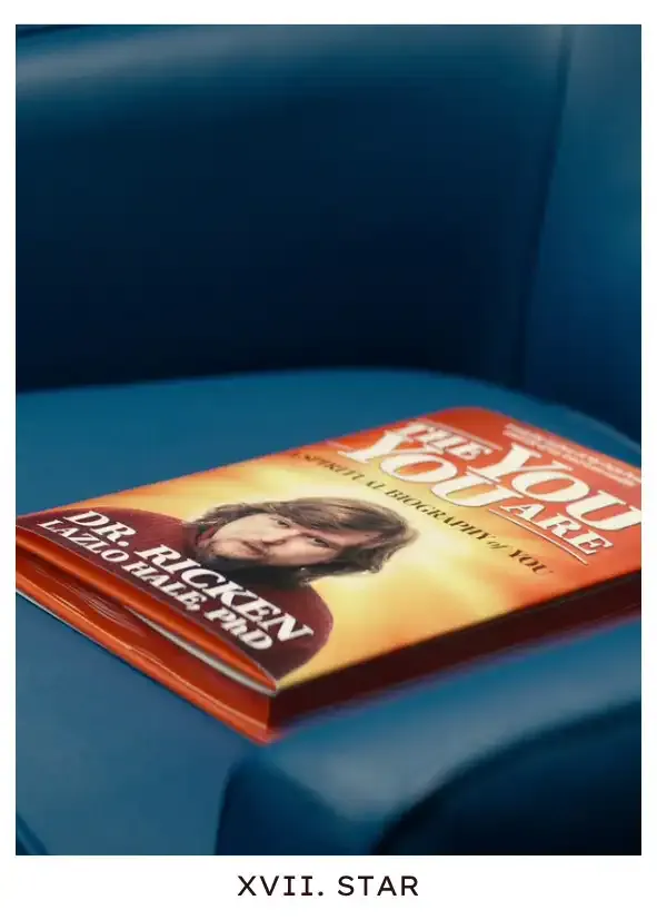 Star: Ricken's book, The You You Are, is sitting in a chair where Irving finds it, after Cobel has stolen it from outie Mark's doorstep to check for messages and Milchick forgot it while rushing to stop one of Helly's escape attempts. It's contraband with Mark's name on it, a sign and an invitation, that contains the first thoughts the innies are exposed to from someone outside, just as much a person as they are, with the same insecurities and hopes.