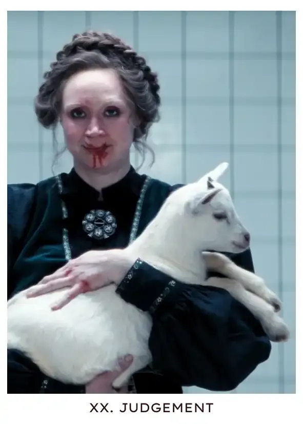 Judgement: Lorne, the department head of Mammalians Nurturable, is dressed in ceremonial garb holding Émile, a baby goat, to her chest. She's smiling through a bloodied face from a hit she took to the nose while protecting innie Mark, and is now professing her thanks to him for having saved one of her charges from a bloody execution, an innocent life who could've died if not for his intervention, like many before it.