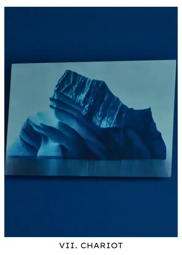 Chariot: A picture of a big iceberg from Milchick's office, a reminder that he keeps in the name of the Empathy reforms he was meant to lead. In this scene, reminded that he has given up his life for the sake of thankless, unempathetic work, he looks at it longingly.